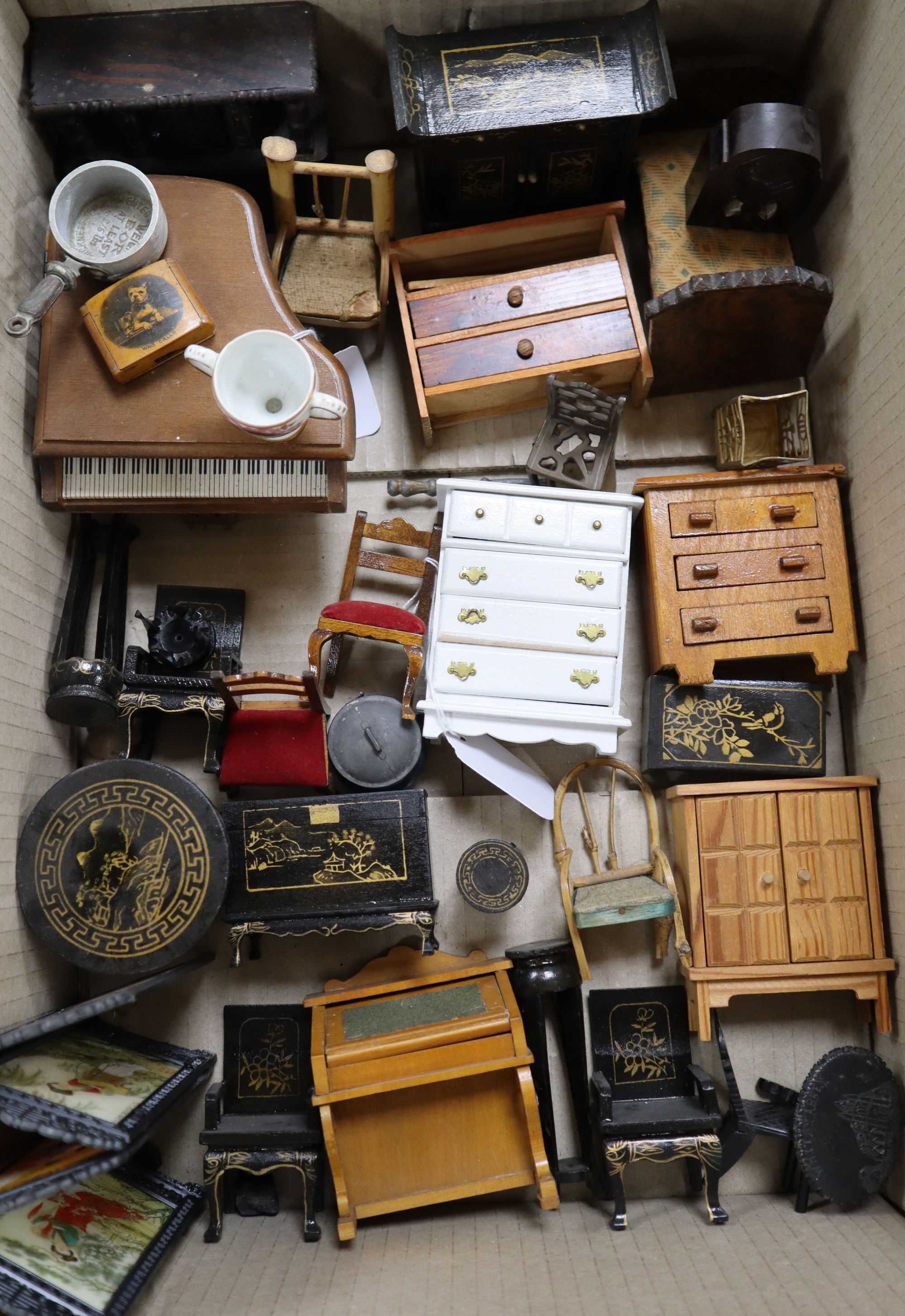 A collection of dolls and dolls house furniture displayed in room settings in a pine cupboard, width 84cm, depth 36cm, height 132cm